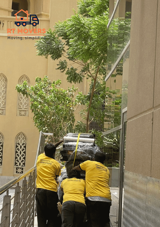 our Professional movers and packers Staff transporting items to customer's new house.